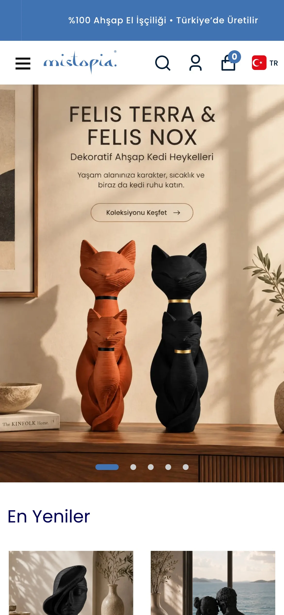 The Mistopia store on a phone: a featured collection of wooden cat sculptures